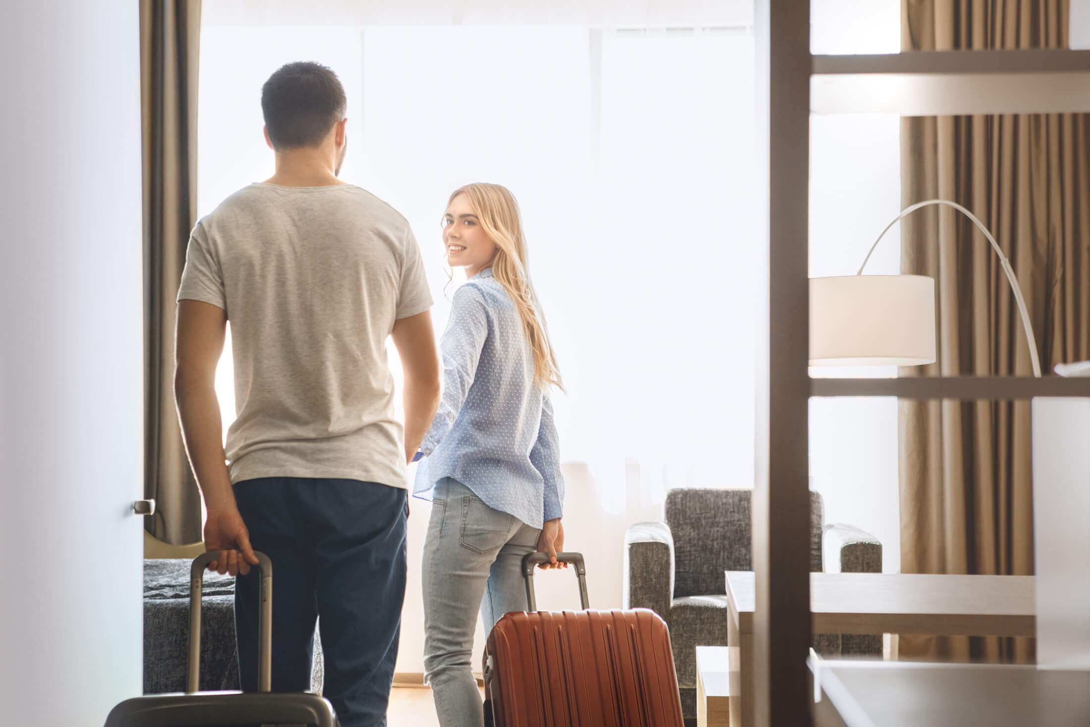 Couple arriving to their hotel room