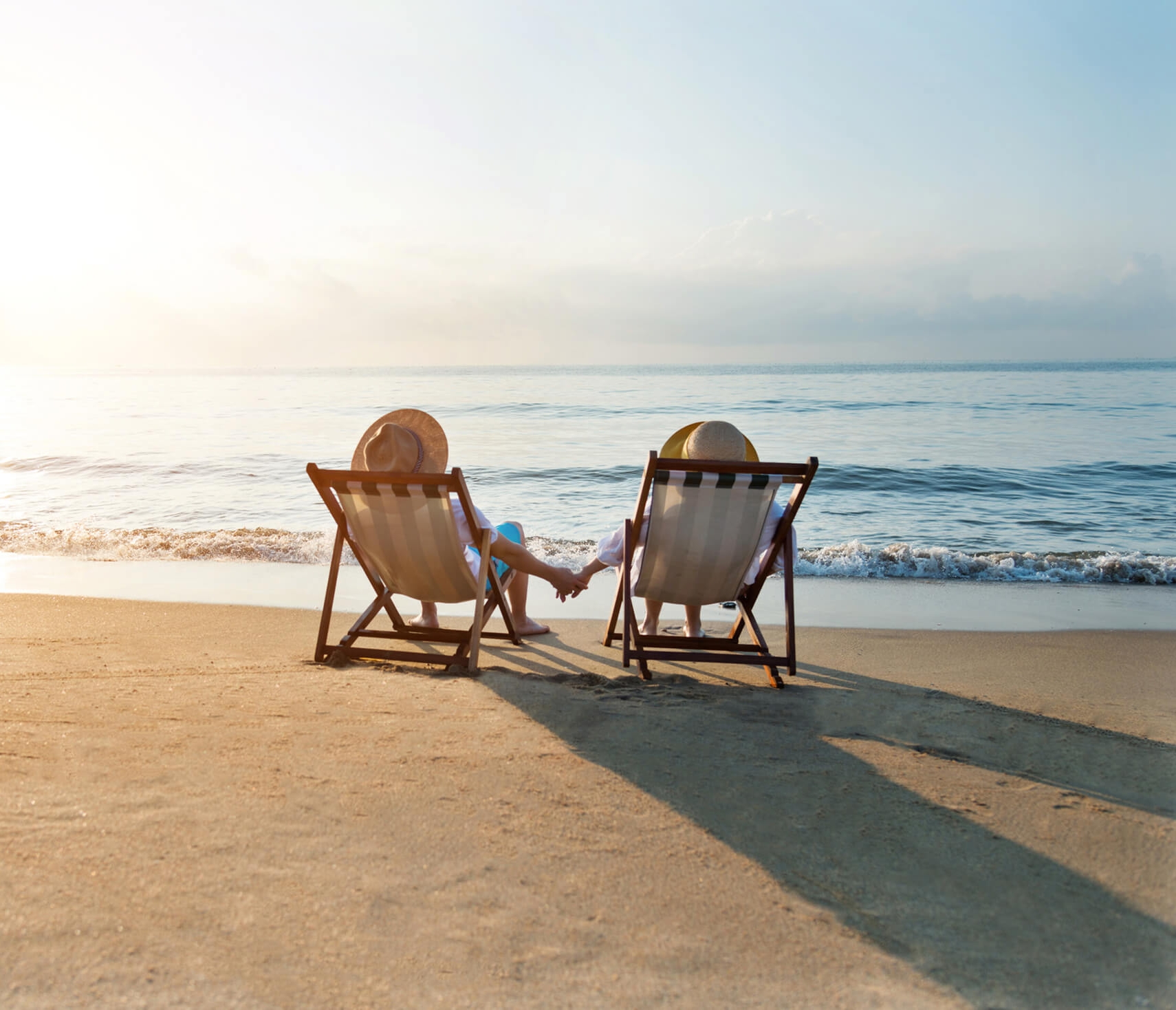 Couple lounging on beach chairs