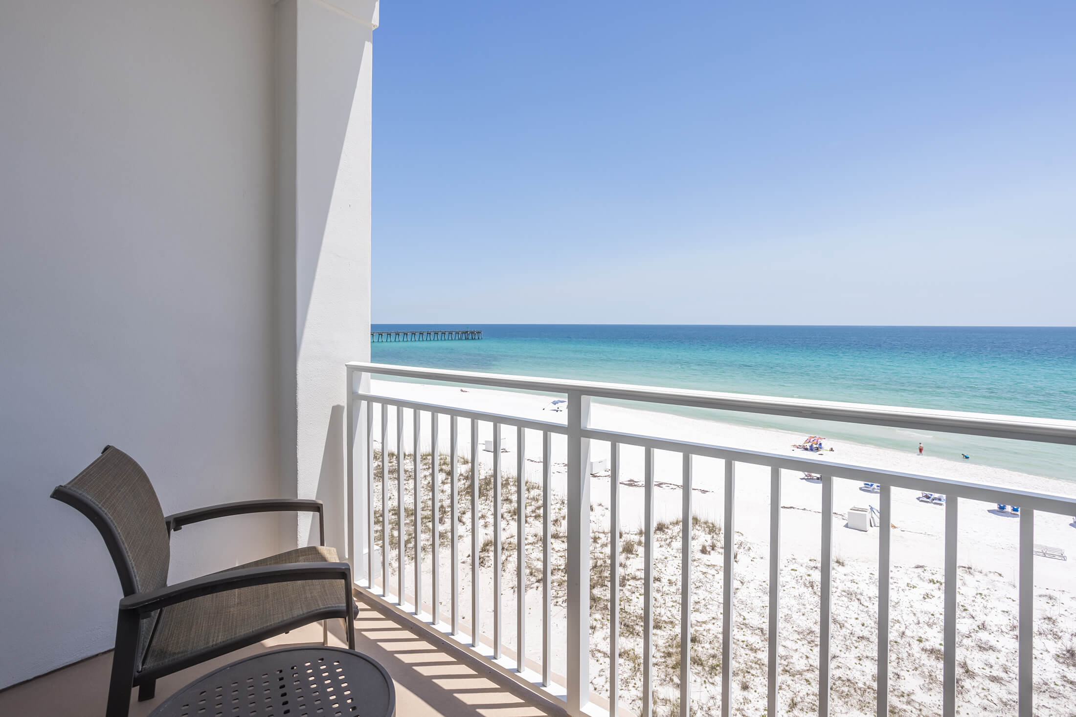 Patio overlooking the beach at Pensacola Beach Resort