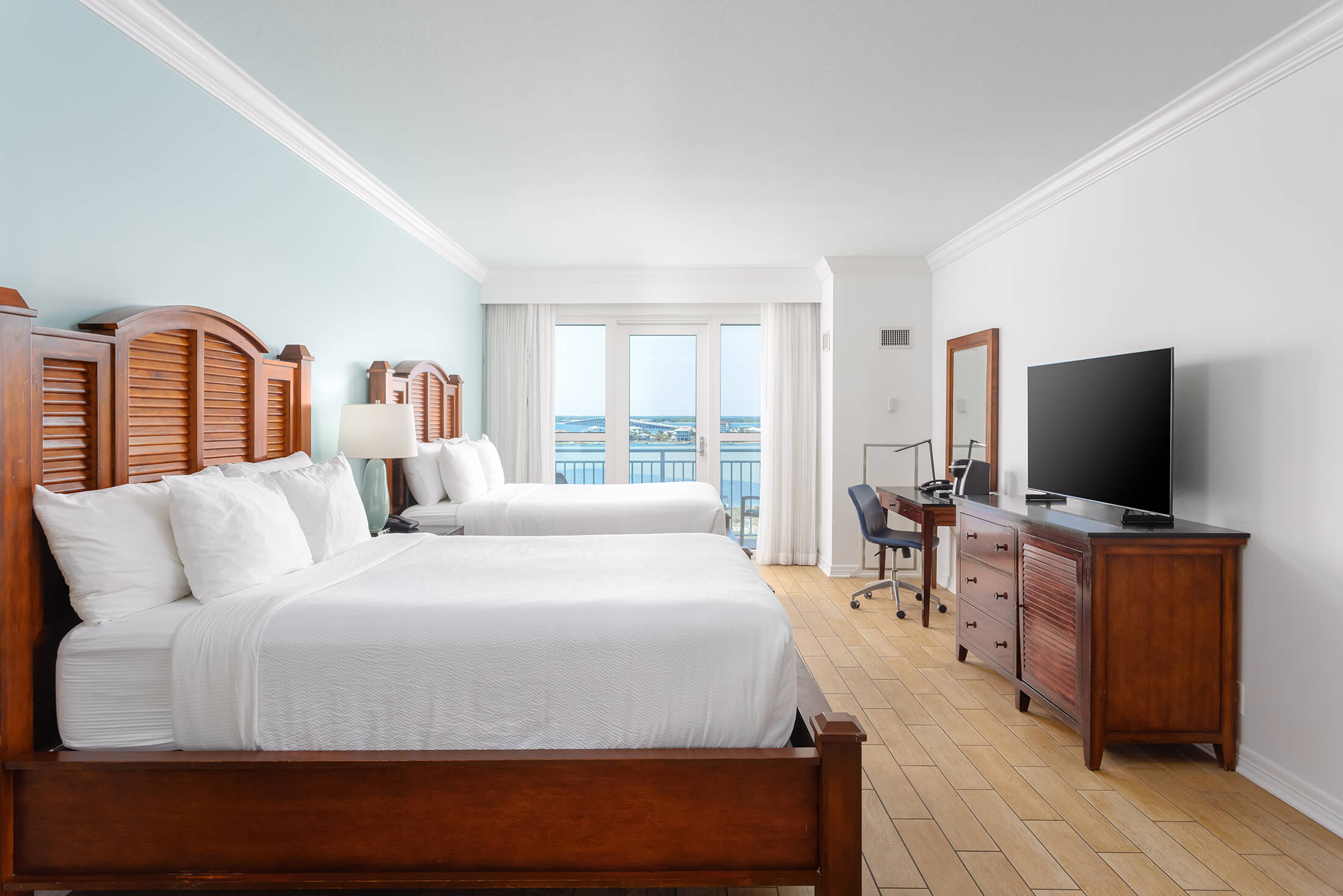 Side view of beds in a room a Pensacola Beach Resort